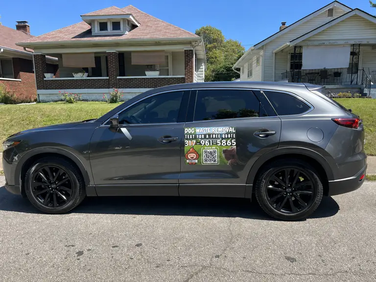 Real visit photo: the Purge Pros service vehicle with the business sign on its door.